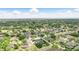Aerial view of a home in a lush, green neighborhood with mature trees at 158 Hickory Stick Ct, Debary, FL 32713