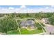 Aerial view of a beautiful home showcasing its landscaping and mature trees at 158 Hickory Stick Ct, Debary, FL 32713