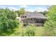 Aerial view showcasing the backyard, screened-in patio, and lush landscaping at 158 Hickory Stick Ct, Debary, FL 32713