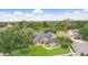 Sprawling property with lush landscaping, mature trees, and a well-manicured lawn, offering a private and serene setting at 158 Hickory Stick Ct, Debary, FL 32713