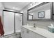 Well-lit bathroom featuring a walk-in shower, white vanity, and neutral decor at 158 Hickory Stick Ct, Debary, FL 32713