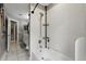 Clean bathroom with a combined shower and tub, featuring white tiling and modern fixtures at 158 Hickory Stick Ct, Debary, FL 32713