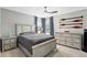 Comfortable bedroom with neutral tones, featuring a cozy bed and modern furnishings at 158 Hickory Stick Ct, Debary, FL 32713