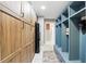 Hallway with built-in storage, lockers, and a refrigerator at 158 Hickory Stick Ct, Debary, FL 32713