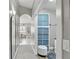 A hallway with blue storage shelves leads to other rooms in the home at 158 Hickory Stick Ct, Debary, FL 32713