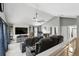 Spacious loft area designed as a home theater with tiered seating and a large screen TV at 158 Hickory Stick Ct, Debary, FL 32713