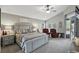 A spacious main bedroom features vaulted ceilings, carpet floors, seating area and backyard access at 158 Hickory Stick Ct, Debary, FL 32713