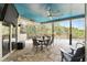 Screened-in patio with a pool view, outdoor seating, and a ceiling fan at 158 Hickory Stick Ct, Debary, FL 32713