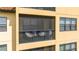 Private screened-in balcony furnished with stylish chairs, offering a cozy outdoor space with ample natural light at 16300 County Road 455 # 606, Montverde, FL 34756