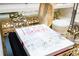 This decor has a golden tray with a book and hourglass, perfect for display purposes at 16300 County Road 455 # 606, Montverde, FL 34756