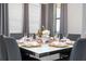 Tastefully arranged dining area with a modern table setting and ample natural light at 16300 County Road 455 # 606, Montverde, FL 34756