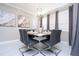 Contemporary dining room with marble floors, a modern table setting and stylish decor at 16300 County Road 455 # 606, Montverde, FL 34756