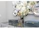 The hallway has a decorative mirror, adding a touch of glamor to the space and amplifying light at 16300 County Road 455 # 606, Montverde, FL 34756
