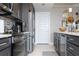 Modern kitchen featuring stainless steel appliances, sleek cabinetry, and a doorway to the next living space at 16300 County Road 455 # 606, Montverde, FL 34756