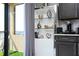 Close-up on kitchen cabinet with coffee bar and balcony access providing natural light for a cozy experience at 16300 County Road 455 # 606, Montverde, FL 34756