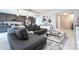 Open-concept living room boasts stylish decor, comfortable seating, and modern finishes, seamlessly connecting to the kitchen at 16300 County Road 455 # 606, Montverde, FL 34756
