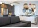 Chic living room featuring modern decor, comfortable seating, and a stylish accent wall with decorative mirrors at 16300 County Road 455 # 606, Montverde, FL 34756