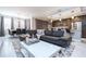 The open floor plan enhances the flow between the living room, dining area, and the modern kitchen at 16300 County Road 455 # 606, Montverde, FL 34756