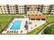 Community pool with abundant lounge seating and outdoor dining, providing a perfect place for relaxation and socializing at 16300 County Road 455 # 606, Montverde, FL 34756