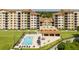Community pool with abundant lounge seating and outdoor dining, providing a perfect place for relaxation and socializing at 16300 County Road 455 # 606, Montverde, FL 34756