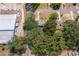 Aerial view of the property nestled among mature trees and a lush landscape at 201 Glenn St, Leesburg, FL 34748