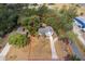 Aerial view outlining property boundaries featuring mature trees and surrounding neighborhood at 201 Glenn St, Leesburg, FL 34748