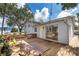 View of home's inviting back deck, perfect for outdoor seating and entertainment at 201 Glenn St, Leesburg, FL 34748