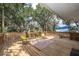 Spacious back deck with wooden railing and comfortable outdoor seating at 201 Glenn St, Leesburg, FL 34748