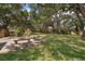 Picturesque backyard with mature trees offering ample shade at 201 Glenn St, Leesburg, FL 34748