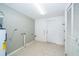 Spacious basement featuring tiled floor, white door, and utility area at 201 Glenn St, Leesburg, FL 34748