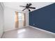 Bedroom with neutral walls, new ceiling fan and spacious closet at 201 Glenn St, Leesburg, FL 34748