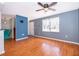 Bright living room features wood flooring, large window and neutral paint colors at 201 Glenn St, Leesburg, FL 34748