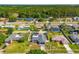 Aerial view of the home with its backyard pool, landscaping, and surrounding neighborhood at 20321 Majestic St, Orlando, FL 32833