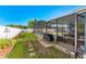 Enjoy the backyard with a screened patio, inviting pool, and beautiful landscaping at 20321 Majestic St, Orlando, FL 32833