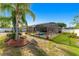 The backyard offers a refreshing pool, screened in patio, and well-manicured lawn at 20321 Majestic St, Orlando, FL 32833