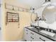 Bathroom featuring dual sinks, modern lighting fixtures, and stylish decor at 20321 Majestic St, Orlando, FL 32833
