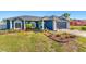 Charming blue single-story home with a well-maintained front yard and an attached garage in a desirable neighborhood at 20321 Majestic St, Orlando, FL 32833