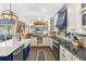 Spacious kitchen with stainless appliances, a large island, and an adjoining living area at 20321 Majestic St, Orlando, FL 32833