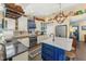 Well-equipped kitchen with white cabinets, stainless steel appliances, and a beautiful center island at 20321 Majestic St, Orlando, FL 32833