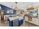 Bright, open kitchen with a large island, stainless steel appliances, and adjoined dining area at 20321 Majestic St, Orlando, FL 32833