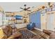 Cozy living room featuring built-in shelving and comfortable seating with a nautical theme at 20321 Majestic St, Orlando, FL 32833