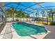 Private screened pool with seating and a white privacy fence; perfect for relaxing and entertaining guests outdoors at 20321 Majestic St, Orlando, FL 32833