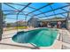 The screened-in pool offers a refreshing escape with ample space for relaxation and entertainment at 20321 Majestic St, Orlando, FL 32833