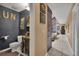 Stylish bathroom with unique decor and a vessel sink, complemented by an expansive hallway at 204 Green Lake Cir, Longwood, FL 32779