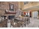 Bright dining room with brick fireplace, tall ceilings, and views into other living spaces at 204 Green Lake Cir, Longwood, FL 32779