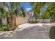 Home exterior with a two-car garage, long driveway, and mature landscaping for added privacy at 204 Green Lake Cir, Longwood, FL 32779