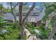 Aerial view of the home showing lush landscaping and a well-maintained exterior at 204 Green Lake Cir, Longwood, FL 32779