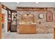 Kitchen featuring a brick alcove with countertop space and decorative wood cabinets at 204 Green Lake Cir, Longwood, FL 32779