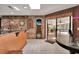 Rustic kitchen featuring brick accents, a wine rack, and an open view to the screened-in porch at 204 Green Lake Cir, Longwood, FL 32779