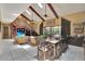 Spacious living room with vaulted ceilings, skylights, tile floors, and backyard views at 204 Green Lake Cir, Longwood, FL 32779